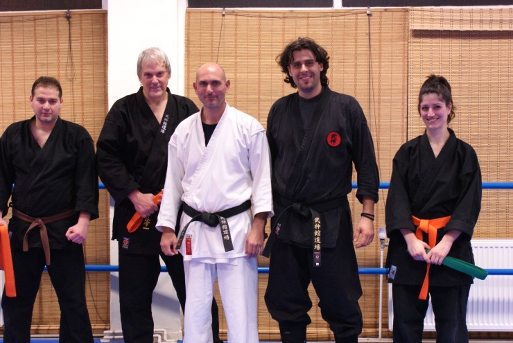 Sensei Athanasios Kapnas as chief instructor and examiner with instructor George Karakostas and the students under examination